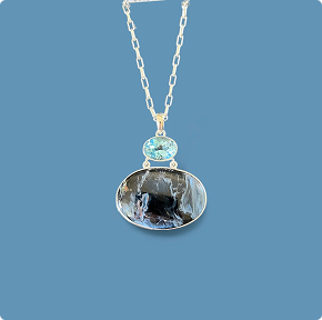 Pietersite Necklace accented with Blue Topaz. 18" SS Chain